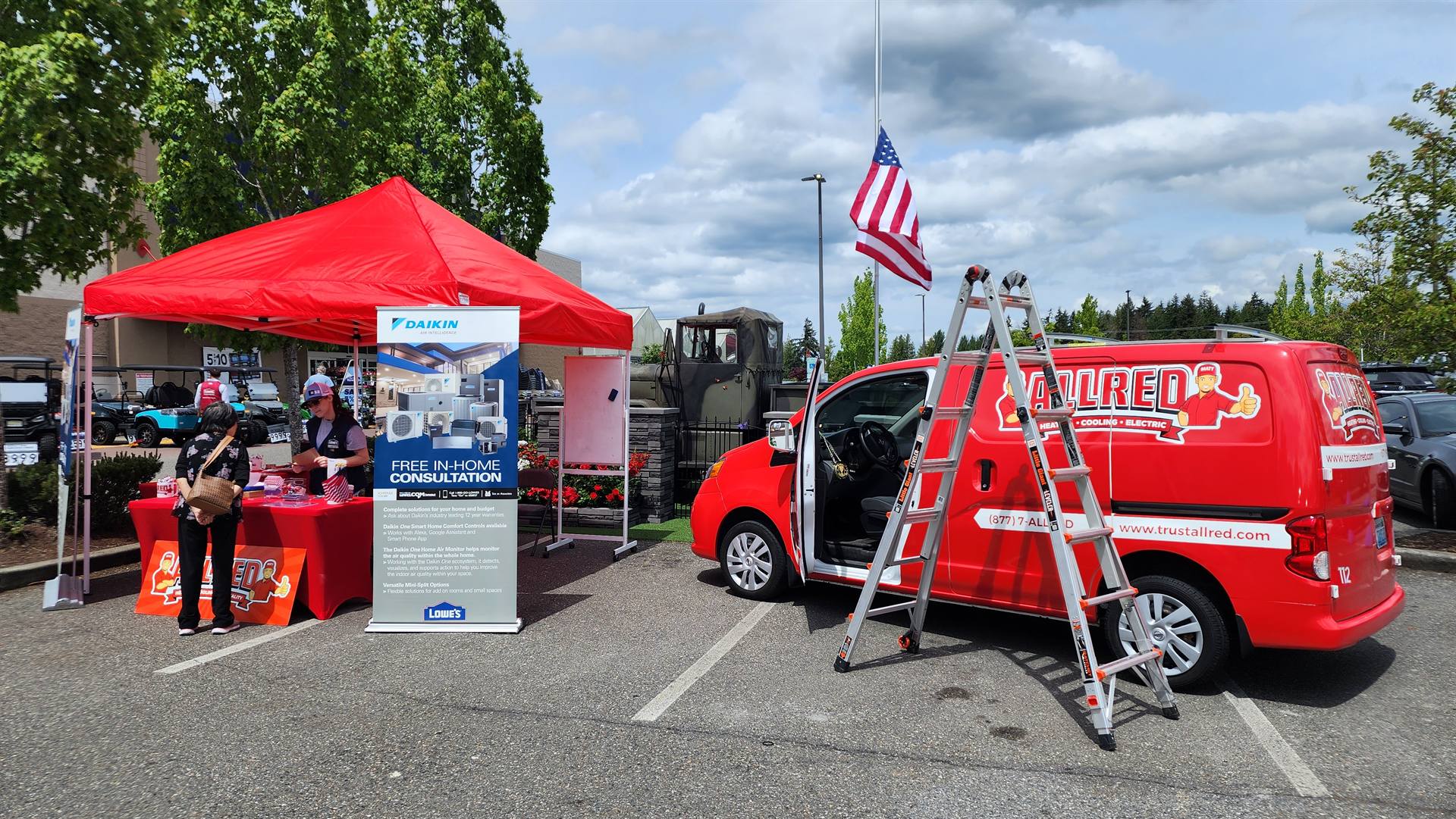 Allred team members at a community event tent during a Memorial Day weekend Lowe's partnership.